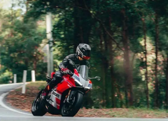 A boy riding a heavyBike