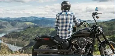 Second chance motorbike loan – rider receiving bike keys after bad-credit loan approval in Australia.
