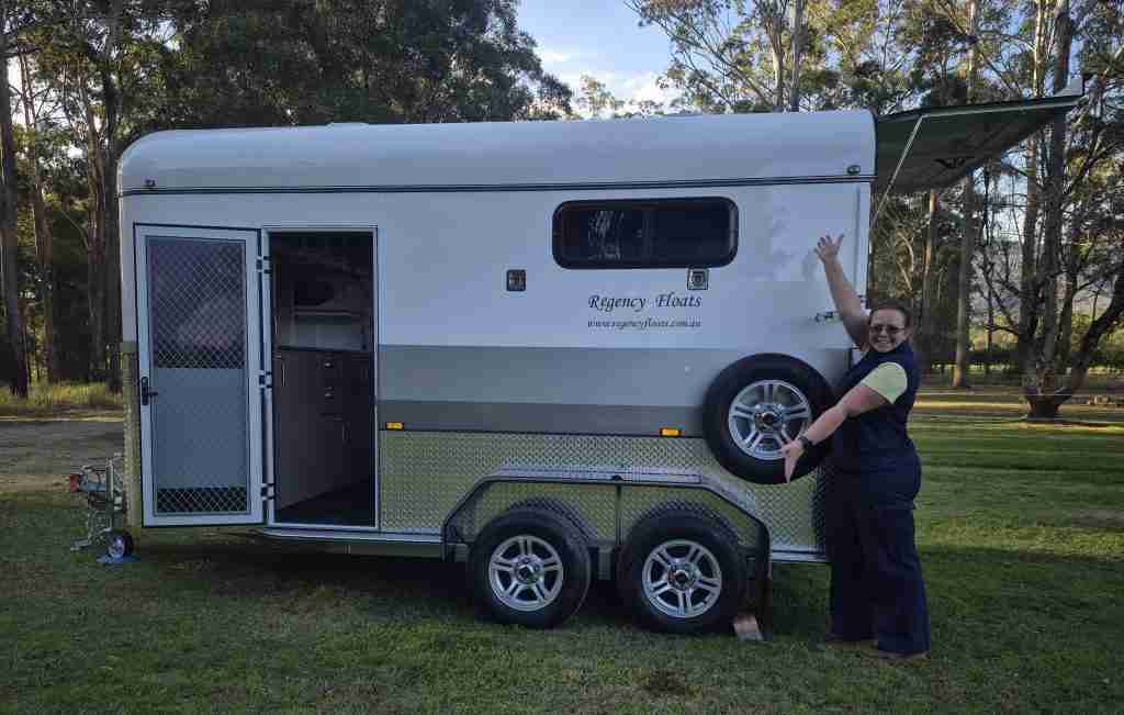 Rebecca from NSW standing proudly next to her brand-new Regency horse float, funded by iCREDIT.