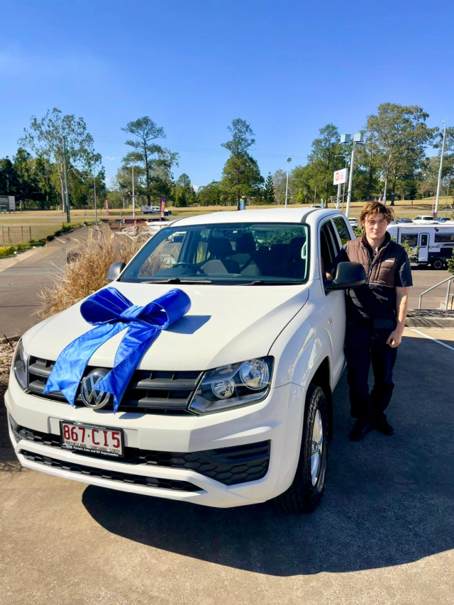 Louis with his white 2021 Volkswagen Amarok purchased from Gympie Auto & RV Supercentre